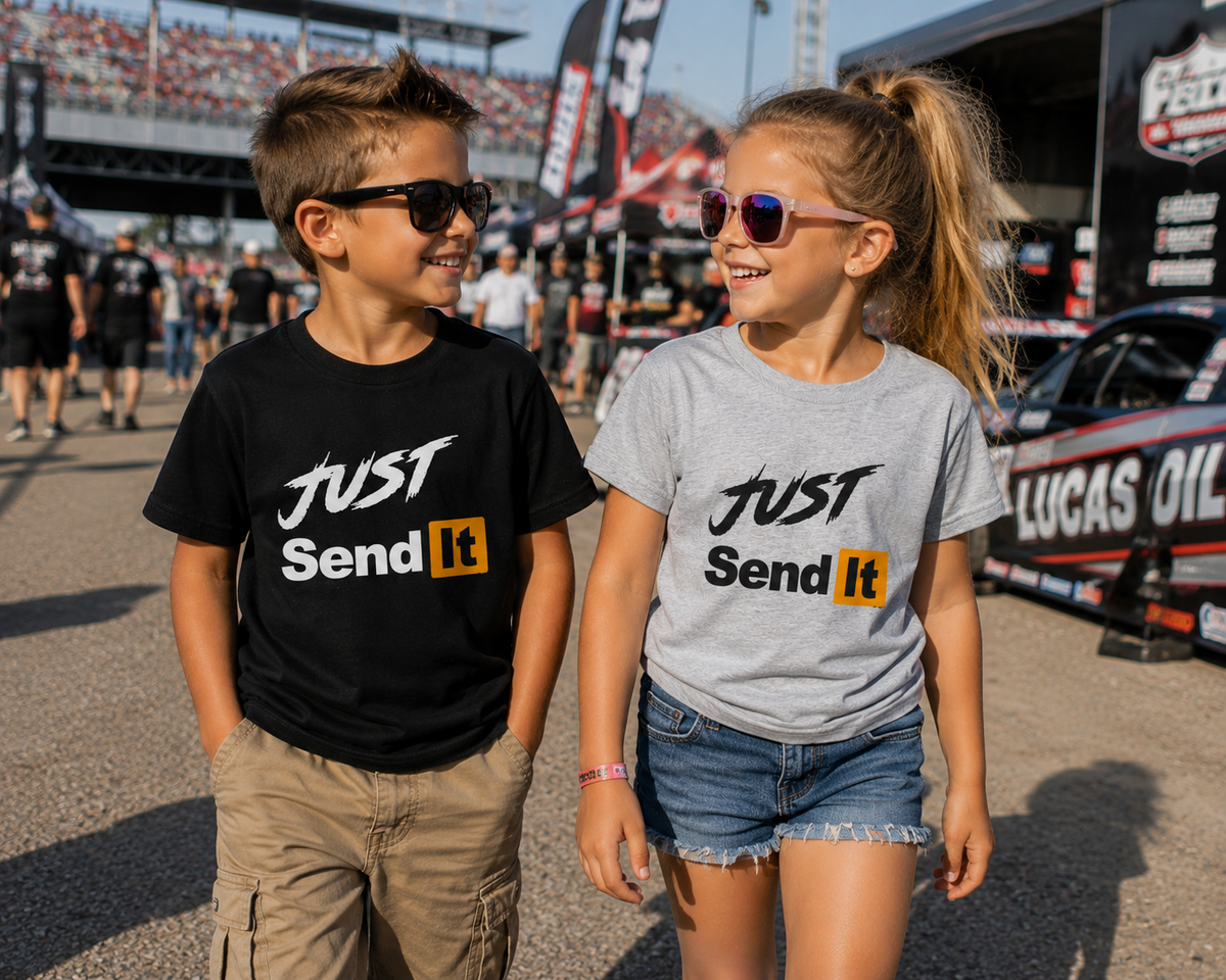 Kids wearing Just Send It youth racing T-shirts at a motorsports event