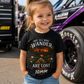 Girl wearing funny 10mm socket toddler mechanic T-shirt at a motorsports event