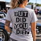 Woman wearing sport gray But Did You Die T-shirt with black distressed back graphic at a motorsports event by Car Chix