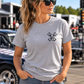 Woman modeling sport gray unisex T-shirt front view at a racetrack by Car Chix