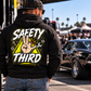 Man wearing black Safety Third hoodie with neon yellow mechanic and racing design by Car Chix