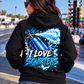 Woman wearing black I Love Squirters nitrous racing hoodie by Car Chix