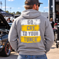 Man wearing a sport grey Car Chix Go Cry to Your Tuner hoodie with distressed white and yellow back graphic and grey knockout lettering at an automotive car meet.