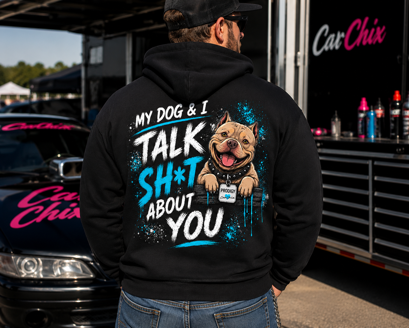 Man wearing black My Dog & I Talk Sh*t About You hoodie with neon blue Prodigy design by Car Chix