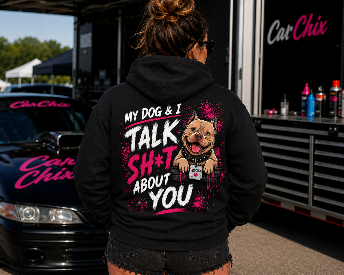 Woman wearing black My Dog & I Talk Sh*t About You hoodie with neon pink Prodigy design by Car Chix