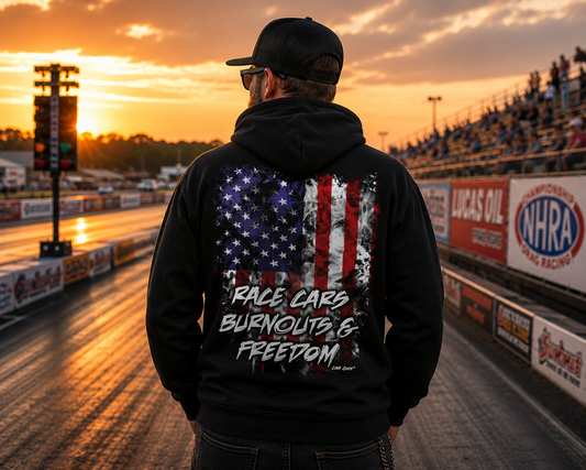 Man wearing black Race Cars Burnouts & Freedom hoodie at the racetrack by Car Chix