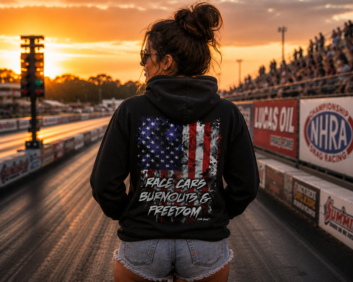 Woman wearing black Race Cars Burnouts & Freedom racing hoodie at sunset by Car Chix