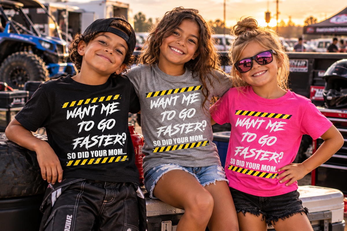 Kids wearing Want Me to Go Faster So Did Your Mom youth racing shirts at a motorsports event