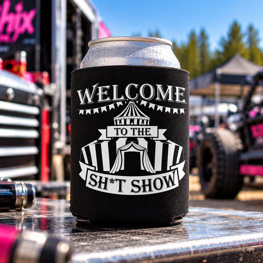 Black Car Chix Welcome to the Sh*tshow can koozie featuring white vintage circus tent artwork on a beverage can at a motorsports event.