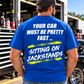 Man modeling a royal blue Car Chix Your Car Must Be Pretty Fast Sitting on Jackstands T-shirt with white distressed text and neon yellow racing-inspired graphics.