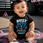 Baby boy wearing Built in the Pits Thanks Mom and Dad racing onesie in a race shop