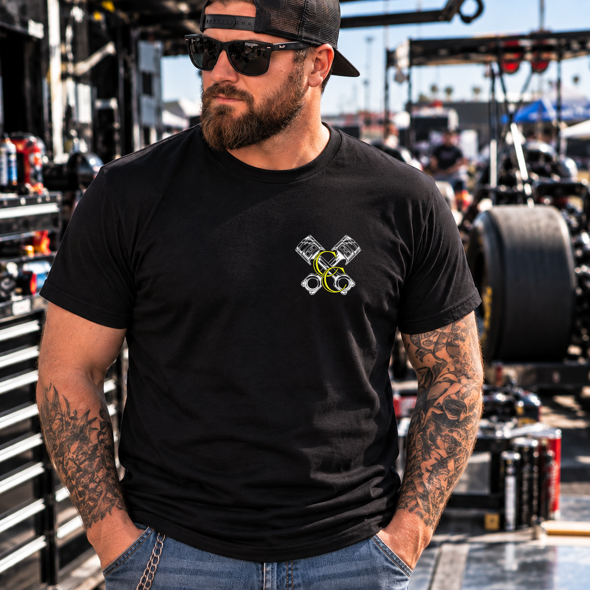 Front view of man wearing black Safety Third T-shirt with Car Chix left chest logo