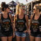 Women wearing funny 10mm socket racerback tank tops at a motorsports event