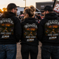 Men and woman wearing funny 10mm socket mechanic hoodies at a dirt track race