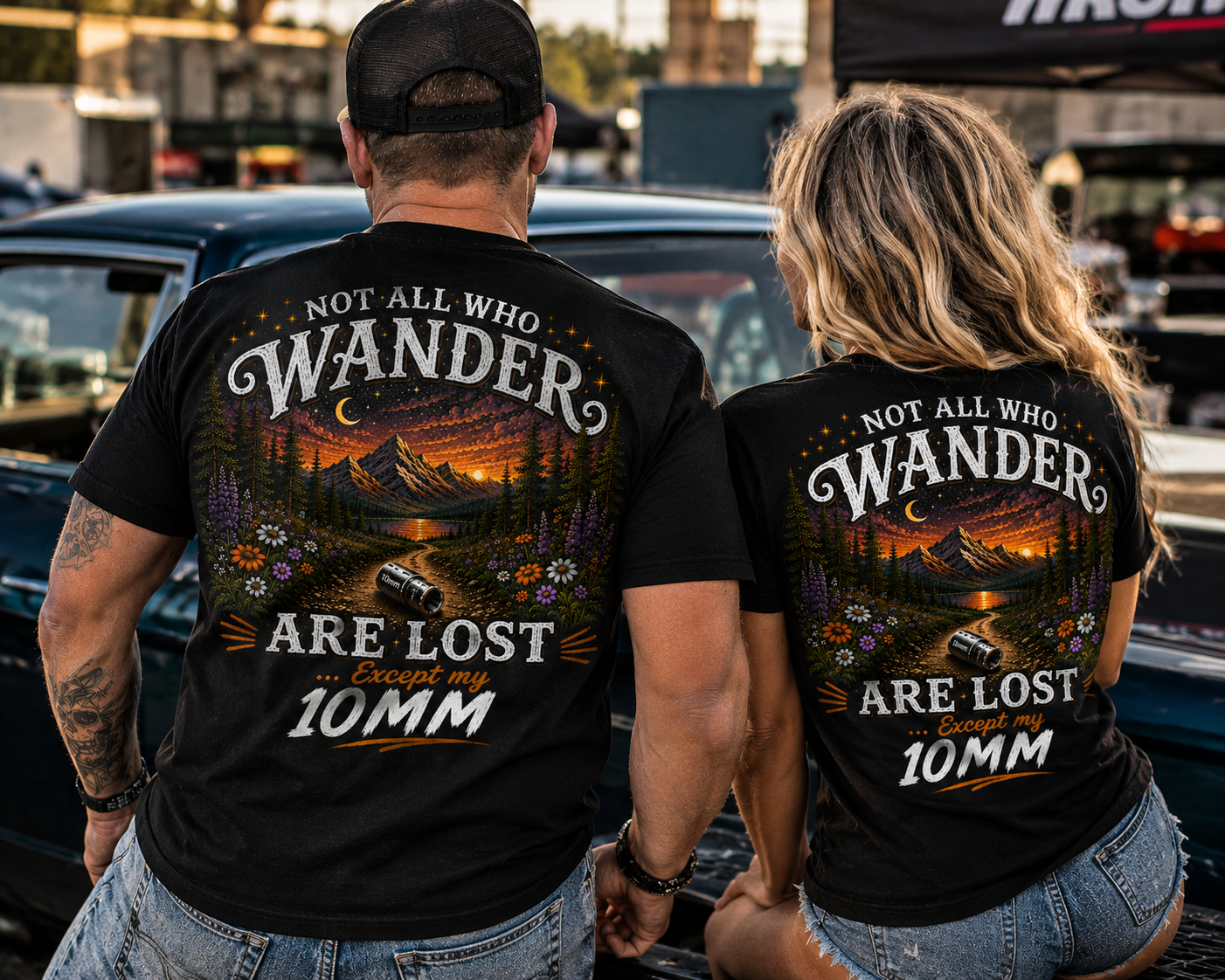 Man and woman wearing funny 10mm socket mechanic shirts at a car show