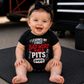 Baby girl wearing I Learned My First Bad Word in the Pits infant racing bodysuit
