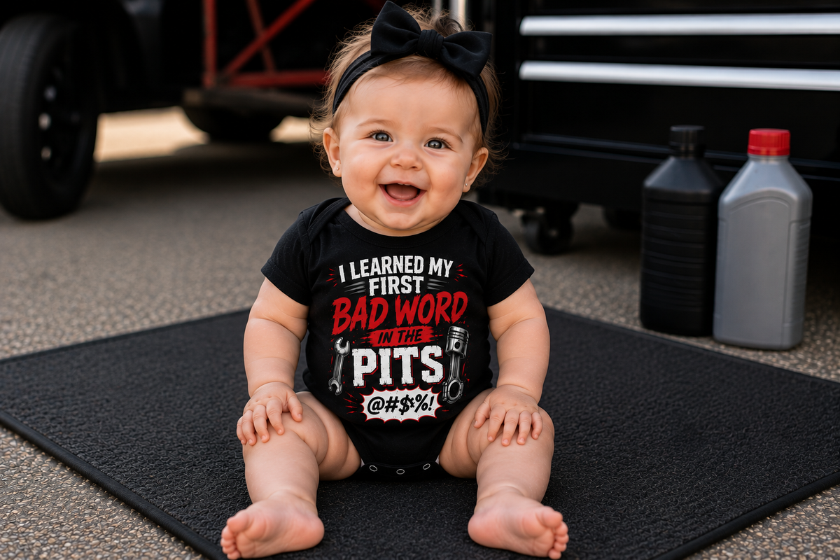 Baby girl wearing I Learned My First Bad Word in the Pits infant racing bodysuit