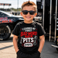 Toddler boy wearing I Learned My First Bad Word in the Pits racing T-shirt at the racetrack