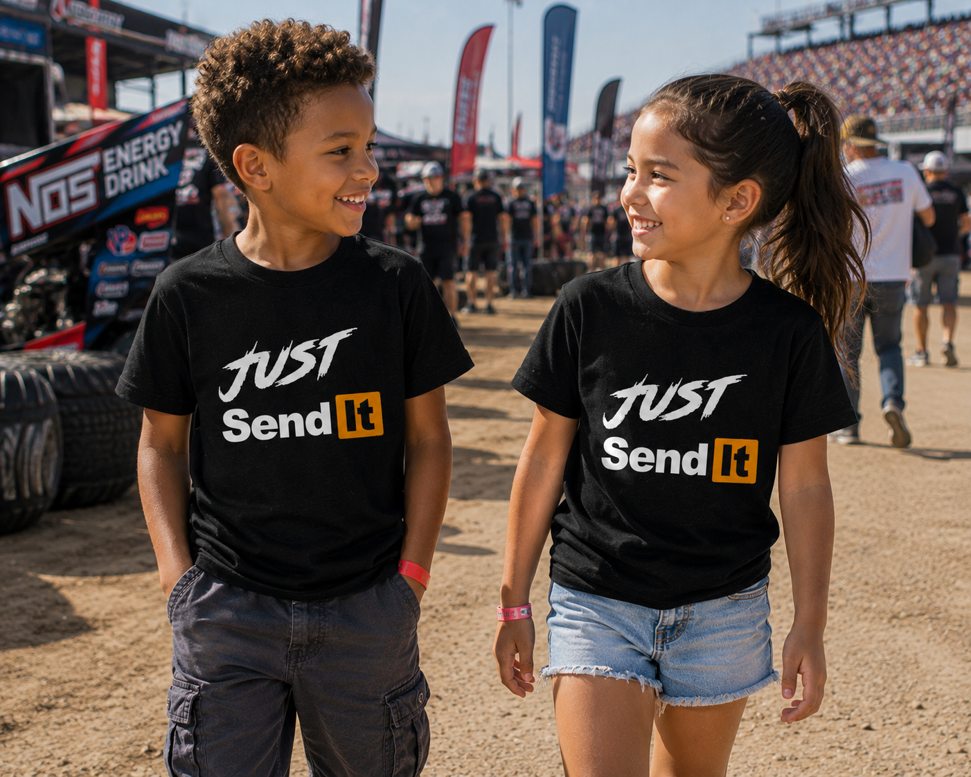 Young race fans wearing Car Chix Just Send It kids racing shirts in the pits