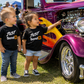 Kids wearing Just Send It toddler racing shirts at a motorsports event