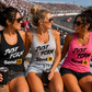 Women wearing Car Chix Just Fckn Send It racing tanks in the grandstands