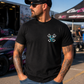 Front view of black My Dog & I Talk Sh*t About You T-shirt with blue Car Chix piston logo