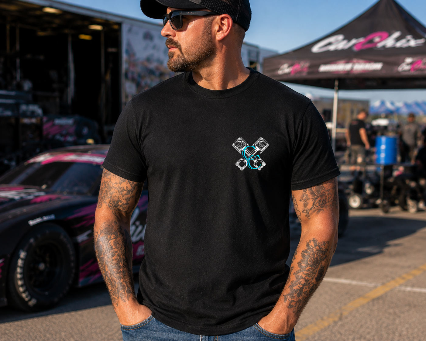 Front view of black My Dog & I Talk Sh*t About You T-shirt with blue Car Chix piston logo