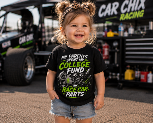 Toddler girl wearing College Fund Race Car Parts kids racing tee in the pits