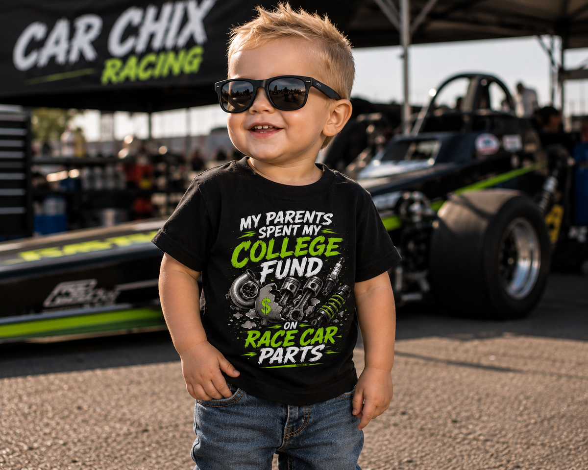 Toddler boy wearing My Parents Spent My College Fund on Race Car Parts racing shirt at the racetrack