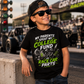 Young race fan wearing College Fund Race Car Parts kids racing tee in the pits