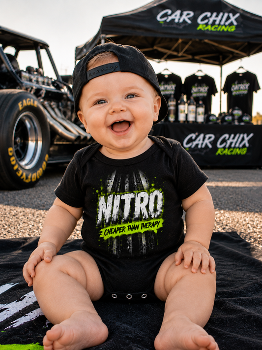 Baby wearing Nitro Cheaper Than Therapy onesie by Car Chix at the racetrack
