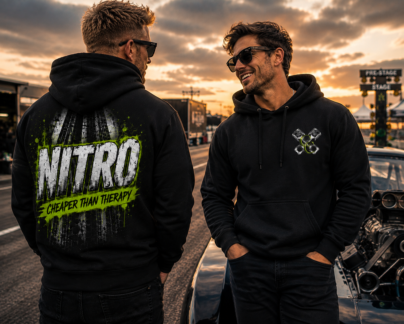 Two men wearing Nitro Cheaper Than Therapy hoodies at the racetrack