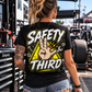 Woman wearing black Safety Third T-shirt with neon yellow racing and mechanic design by Car Chix